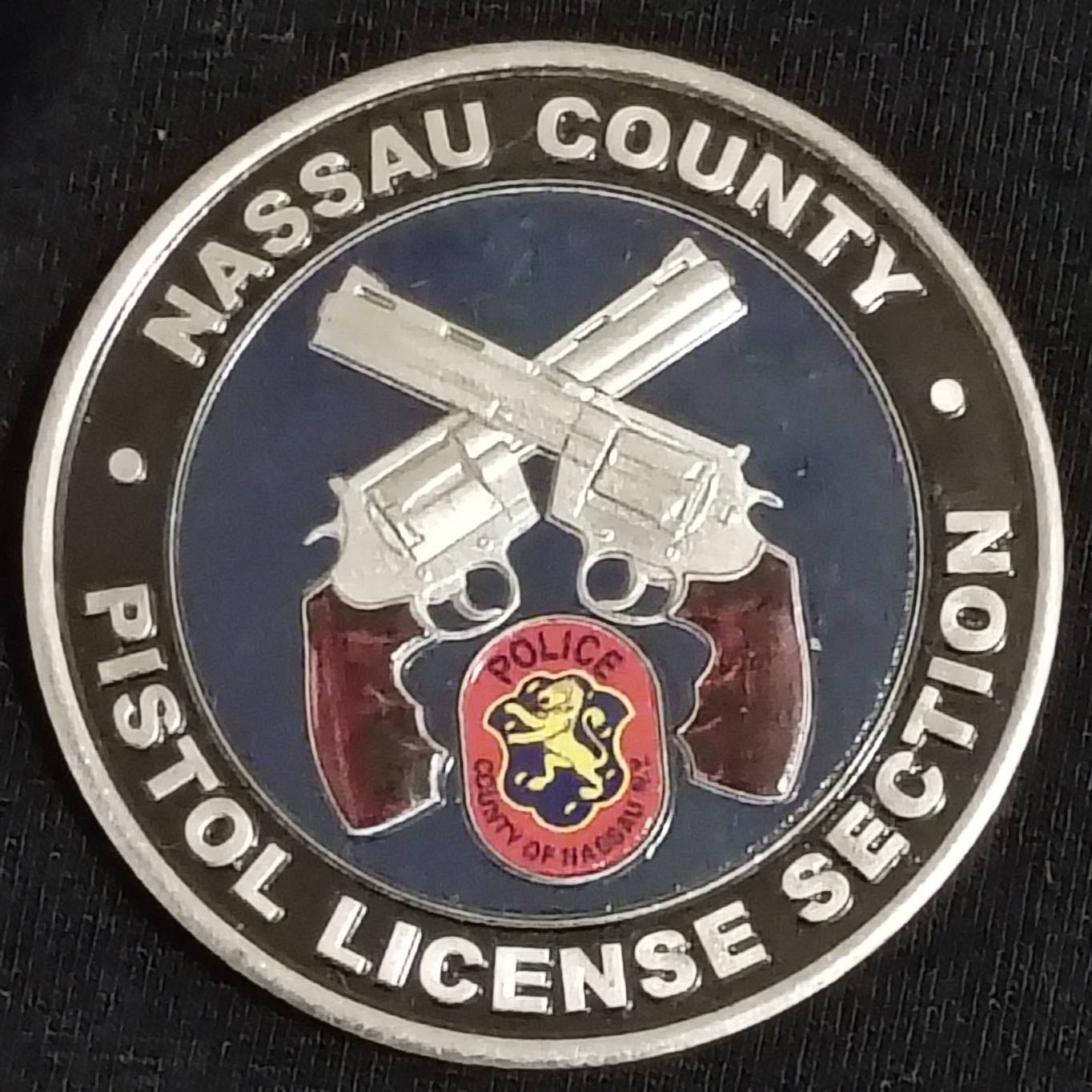 Nassau police pistol license section challenge coin — front