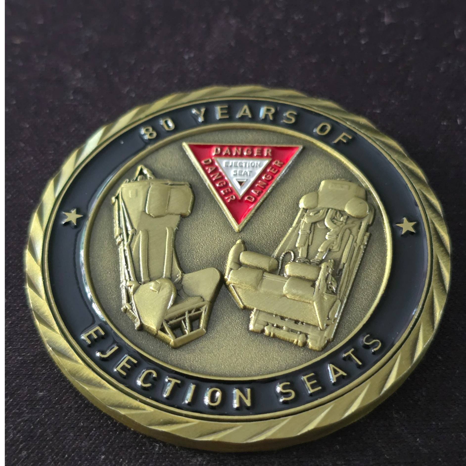 80 Years of Ejection seats brass — front